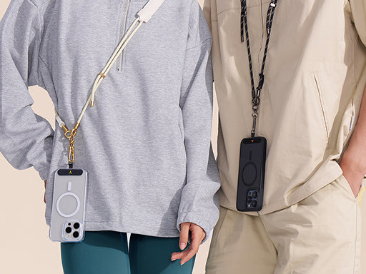 Two people wearing crossbody phone lanyards with magnetic phone cases in a lifestyle scene