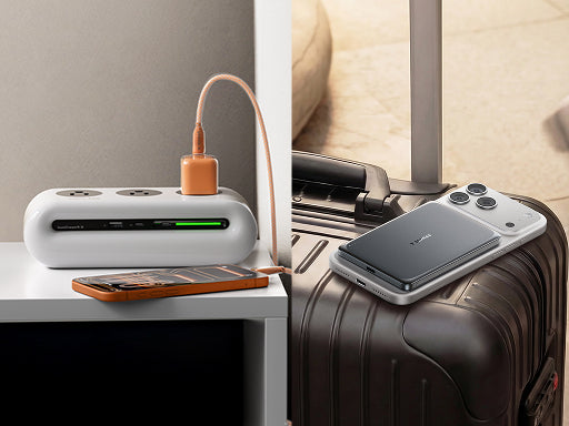 Magnetic power bank charging a smartphone at home and resting on luggage for portable travel use