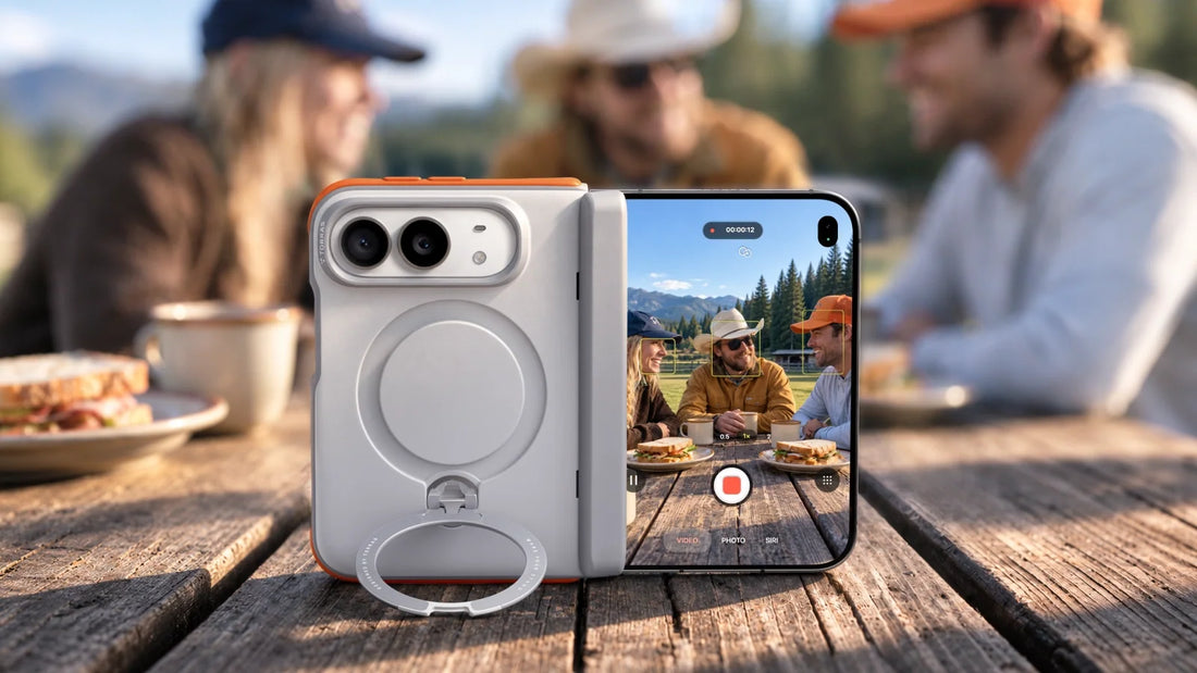 Open foldable phone standing on a cafe table in front of a couple
