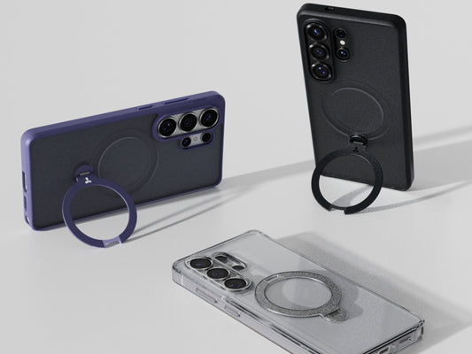 Three phone cases with built-in ring stands in black, purple, and clear finishes
