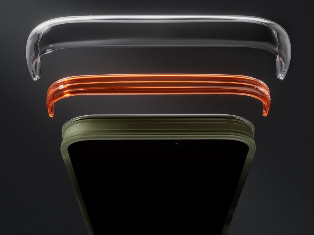 Layered phone case edges showing transparent, orange, and green protective bumpers