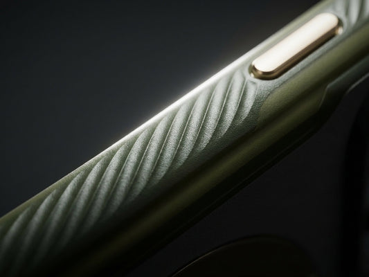 Close-up of a green textured phone case side with a raised button detail