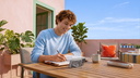 Man sketching outdoors while a smartphone rests on its magnetic ring stand