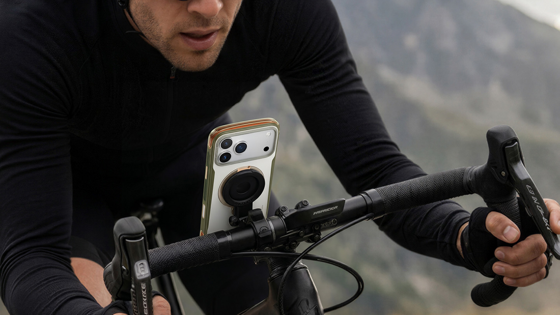Cyclist riding with a TORRAS phone case mounted to the bike handlebar for navigation