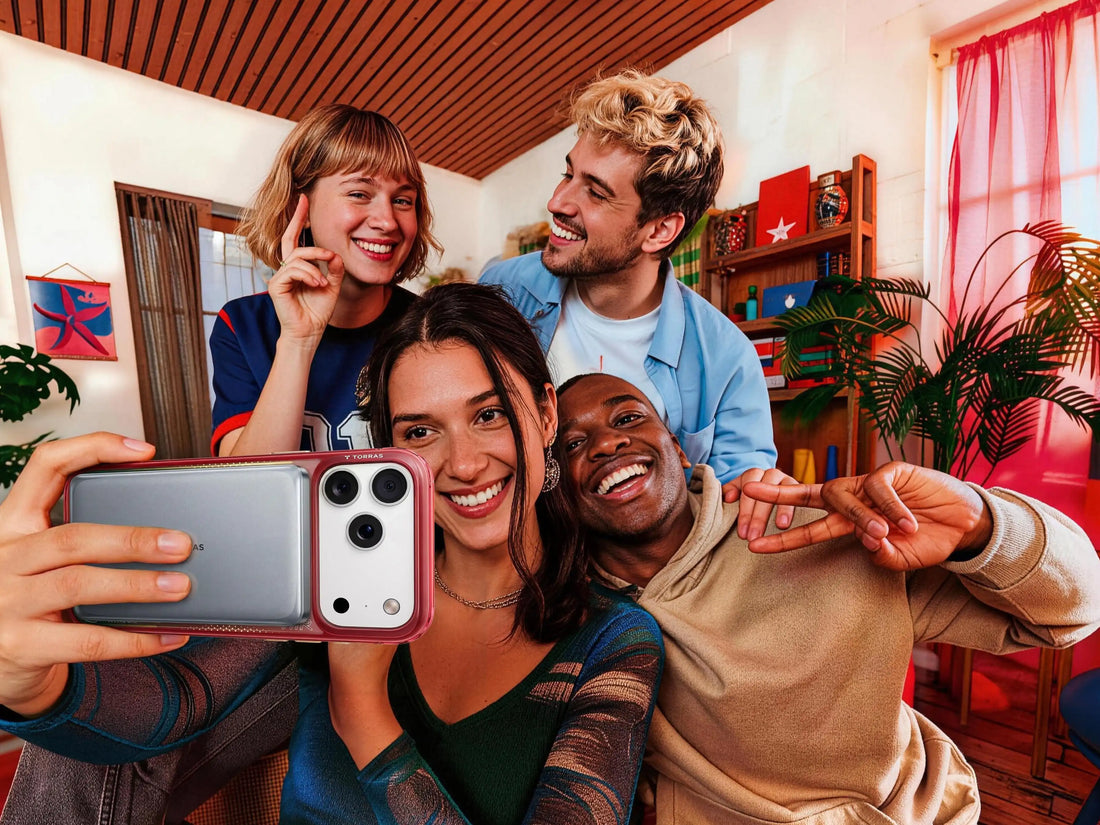 Friends taking a group selfie with a phone and TORRAS magnetic power bank attached