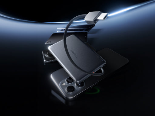Slim magnetic power bank with built-in USB-C cable attached to a smartphone on a dark futuristic background