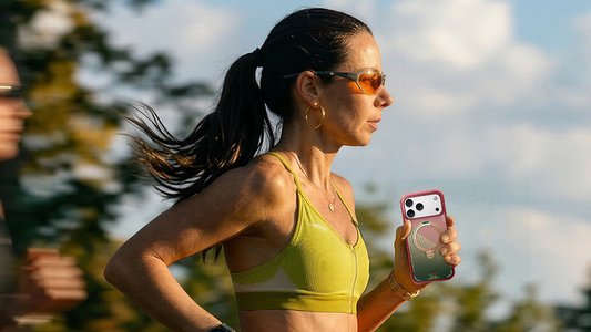 Runner holding a phone with a magnetic ring case during an outdoor workout