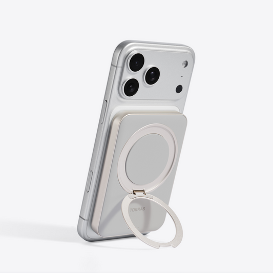 Ostand Power Bank 5000 mAh - TORRAS Ostand Power Bank with magnetic ring stand on a silver iPhone.