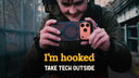 Person holding a smartphone with “I’m hooked” and “Take tech outside” text overlay
