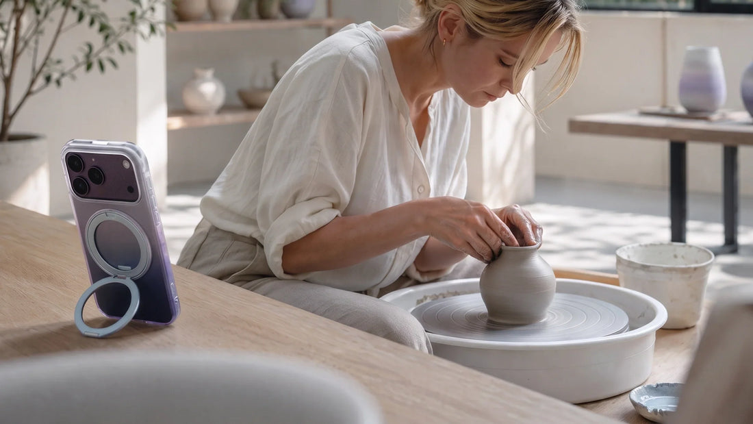 Woman at a vanity checking a phone propped upright on a stand-angle case
