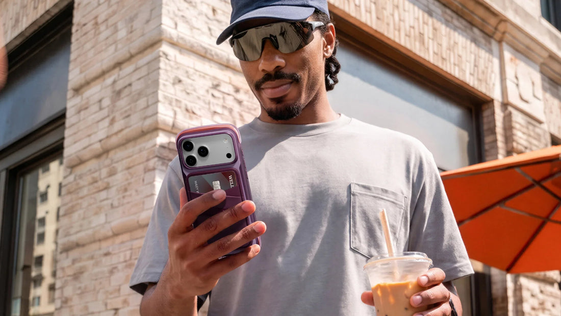 Shopper in a city holding a phone while checking a store list