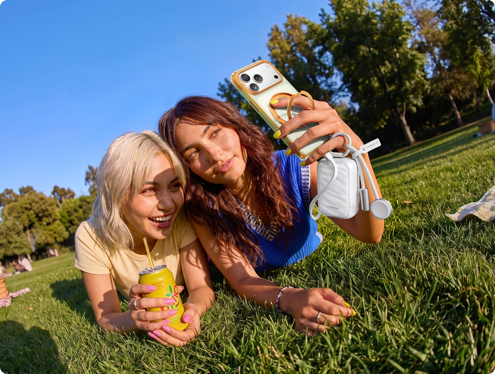 Two friends taking a selfie with a TORRAS ring case