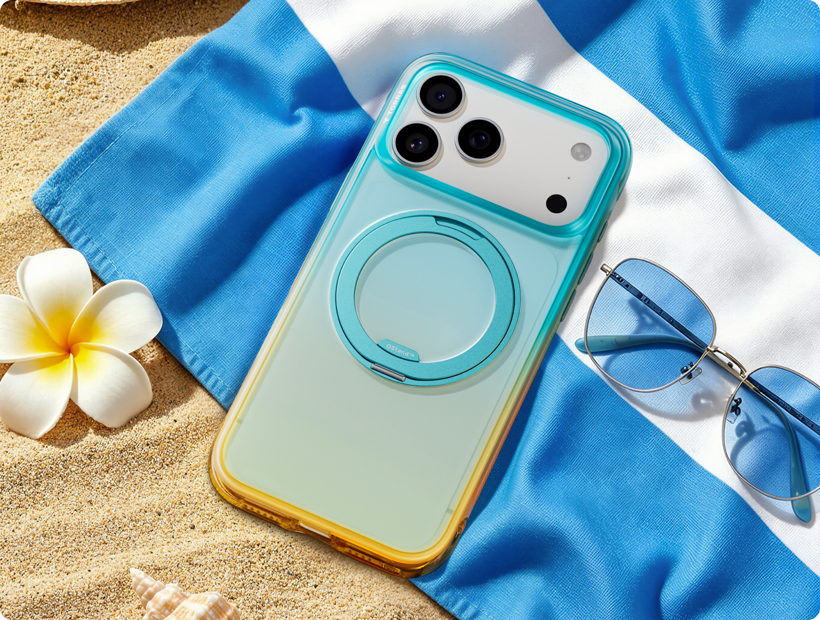 Gradient TORRAS case on a beach towel with sunglasses