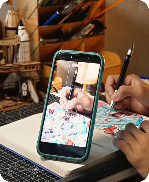 Phone filming a drawing from its TORRAS ring stand