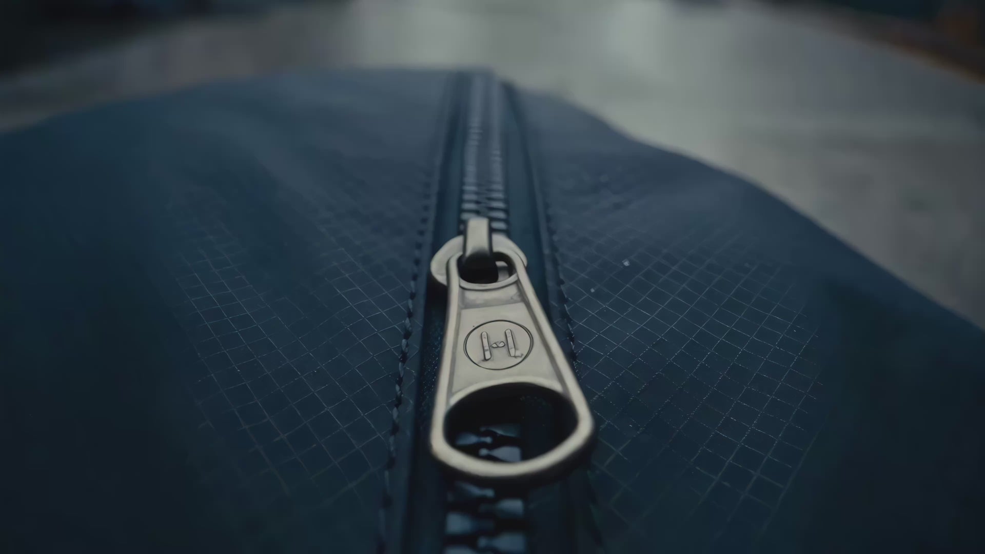 TORRAS branded zipper pull on a fabric accessory